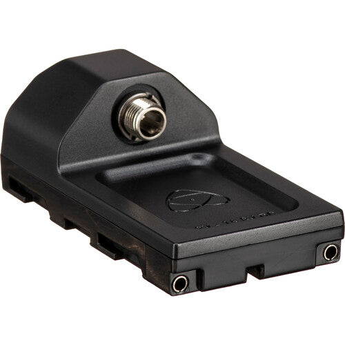 Angled side view of the black Atomos AtomX Battery Eliminator showing the NP-F battery plate with side rails, DC barrel connector, Atomos CAST logo, and voltage label for 6.2V - 16.8V DC