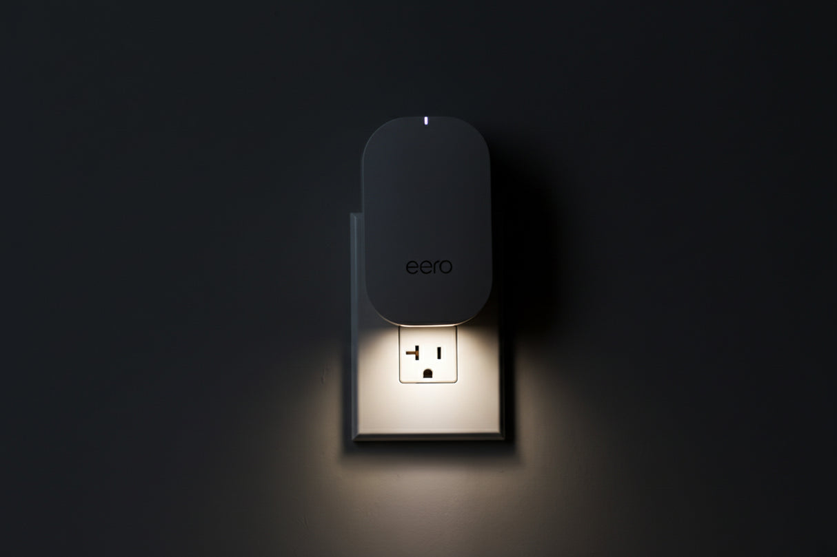 eero Beacon plug-in mesh WiFi extender installed in wall outlet expanding eero network coverage