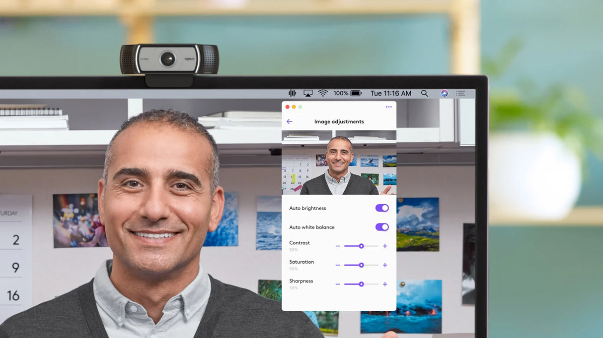 Logitech C930e webcam mounted on monitor displaying man in video call preview with image settings panel open