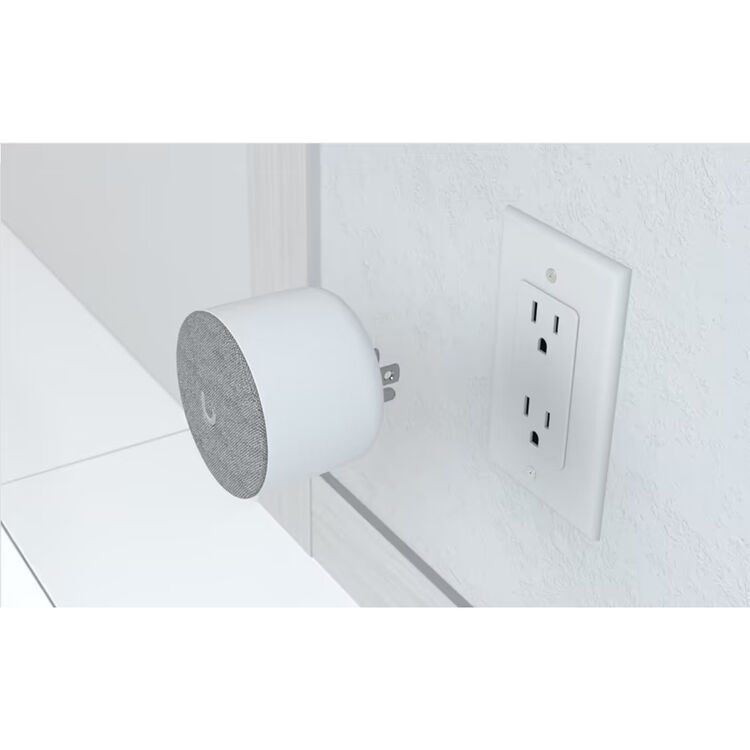 Ubiquiti UniFi WiFi Chime showing side profile and integrated AC plug, white housing and grey front fabric speaker panel for indoor doorbell alerts