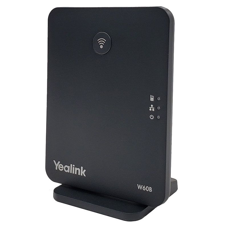 Front angled view of the Yealink W60B DECT IP base station in dark gray, displaying the wireless signal icon, power lock and signal strength green LEDs, power LED, and model label on a white background