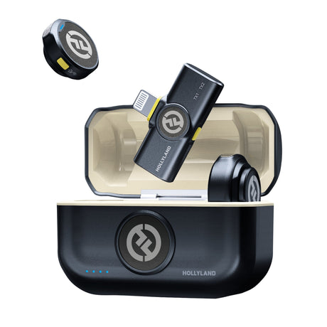 Hollyland Lark M2 Lightning wireless microphone system open charging case (shine charcoal black): black Lightning receiver USB dongle with yellow accent inserted, wireless lavalier transmitter above, Hollyland logo on lid, compact dual-channel 2.4GHz system for iOS devices