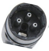 Black 3-pin XLR female connector with three round contacts and white keyway indicator, close-up view