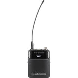 Audio-Technica ATW-T3202 DE2 bodypack wireless transmitter rear view, black chassis with flexible antenna extending upward, OLED display showing 487.500 frequency, RF High power, and mute off status, cH connector input, Audio-Technica branding