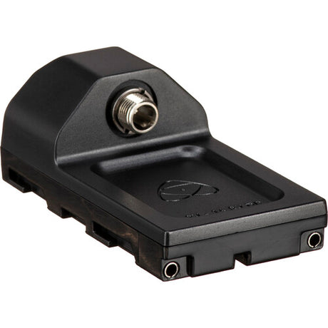 Angled side view of the black Atomos AtomX Battery Eliminator showing the NP-F battery plate with side rails, DC barrel connector, Atomos CAST logo, and voltage label for 6.2V - 16.8V DC