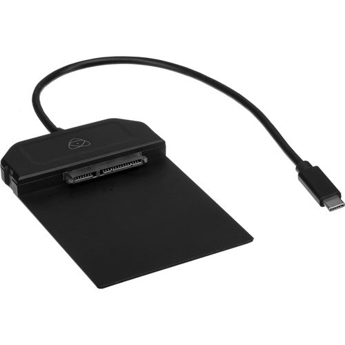Atomos USB-C 3.1 Powered Docking Station product image showing the compact black low-profile dock with integrated USB-C 3.1 cable, power port for RAID caddy support, and branding for Atomos Master Caddy compatibility