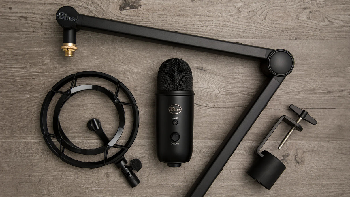 Blue Yeticaster Pro Streaming Bundle with Yeti USB microphone, Radius III shockmount, Compass boom arm, four pickup patterns, gain control, mute, and headphone output