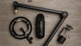 Blue Yeticaster Pro Streaming Bundle with Yeti USB microphone, Radius III shockmount, Compass boom arm, four pickup patterns, gain control, mute, and headphone output