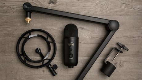 Blue Yeticaster Pro Streaming Bundle with Yeti USB microphone, Radius III shockmount, Compass boom arm, four pickup patterns, gain control, mute, and headphone output