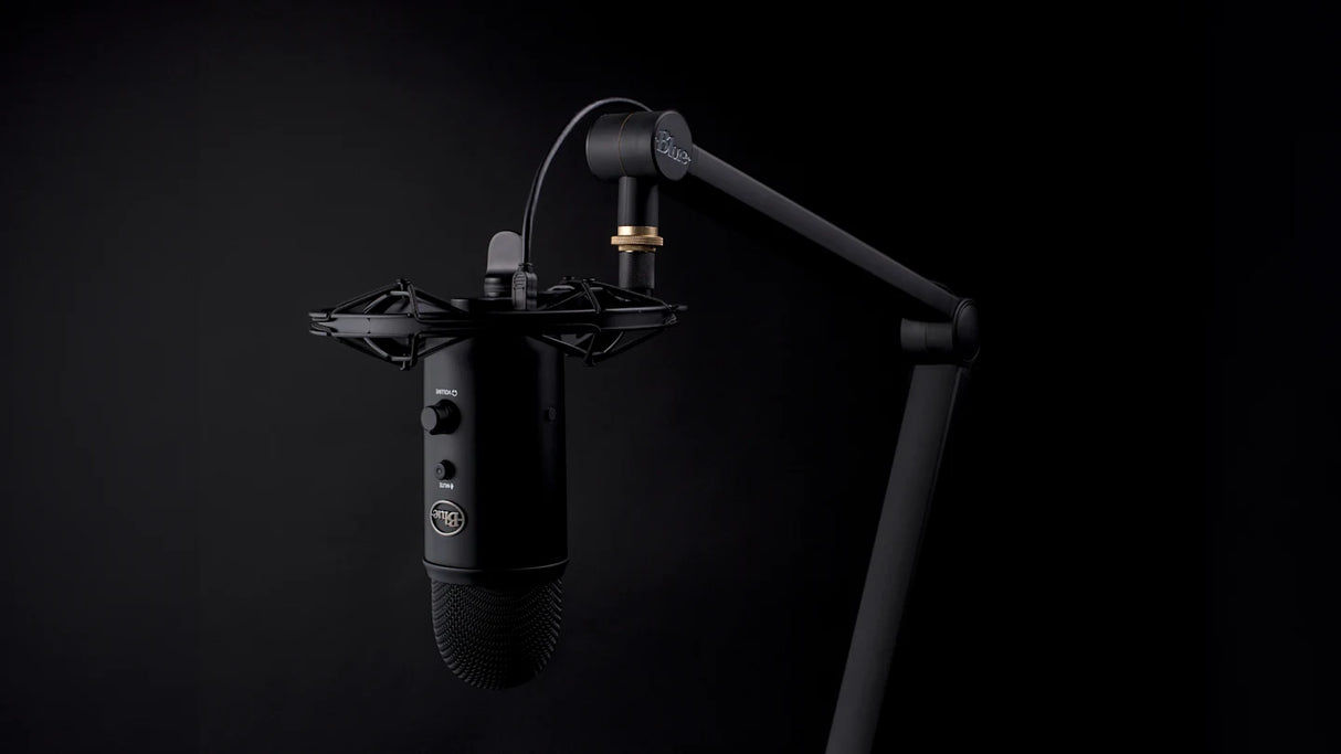 Blue Yeticaster Pro Streaming Bundle with Yeti USB microphone, Radius III shockmount, Compass boom arm, four pickup patterns, gain control, mute, and headphone output