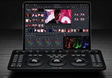 DaVinci Resolve Micro Color Panel with trackballs under a tablet screen displaying color grading interface and video timeline