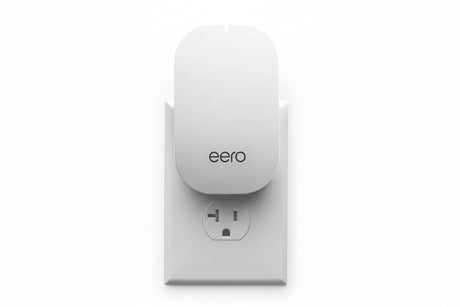 eero Beacon plug-in mesh WiFi extender installed in wall outlet expanding eero network coverage