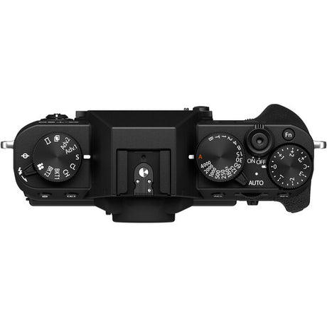 Top view of the black Fujifilm X-T30 II mirrorless camera body showing the vintage-style textured grip, X-mount lens port, and top-plate control dials