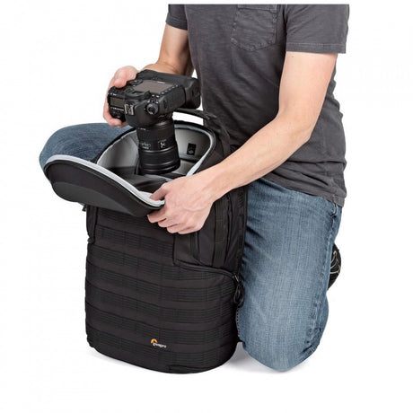 Lowepro ProTactic BP 450 AW II top turret lid open, revealing padded camera insert for quick DSLR or mirrorless grab