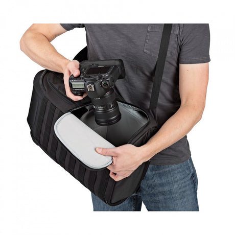 Lowepro ProTactic BP 450 AW II top turret lid open, revealing padded camera insert for quick DSLR or mirrorless grab