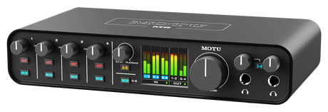 Side angled view of Black MOTU M6 6‑channel USB audio interface shown from the front, featuring four combo XLR/TRS mic/line/Hi‑Z inputs with individual gain knobs and 48V buttons, dual headphone outputs with volume controls, a central monitor volume knob and input/monitor mix knob, and a full‑color LCD level meter display across the top