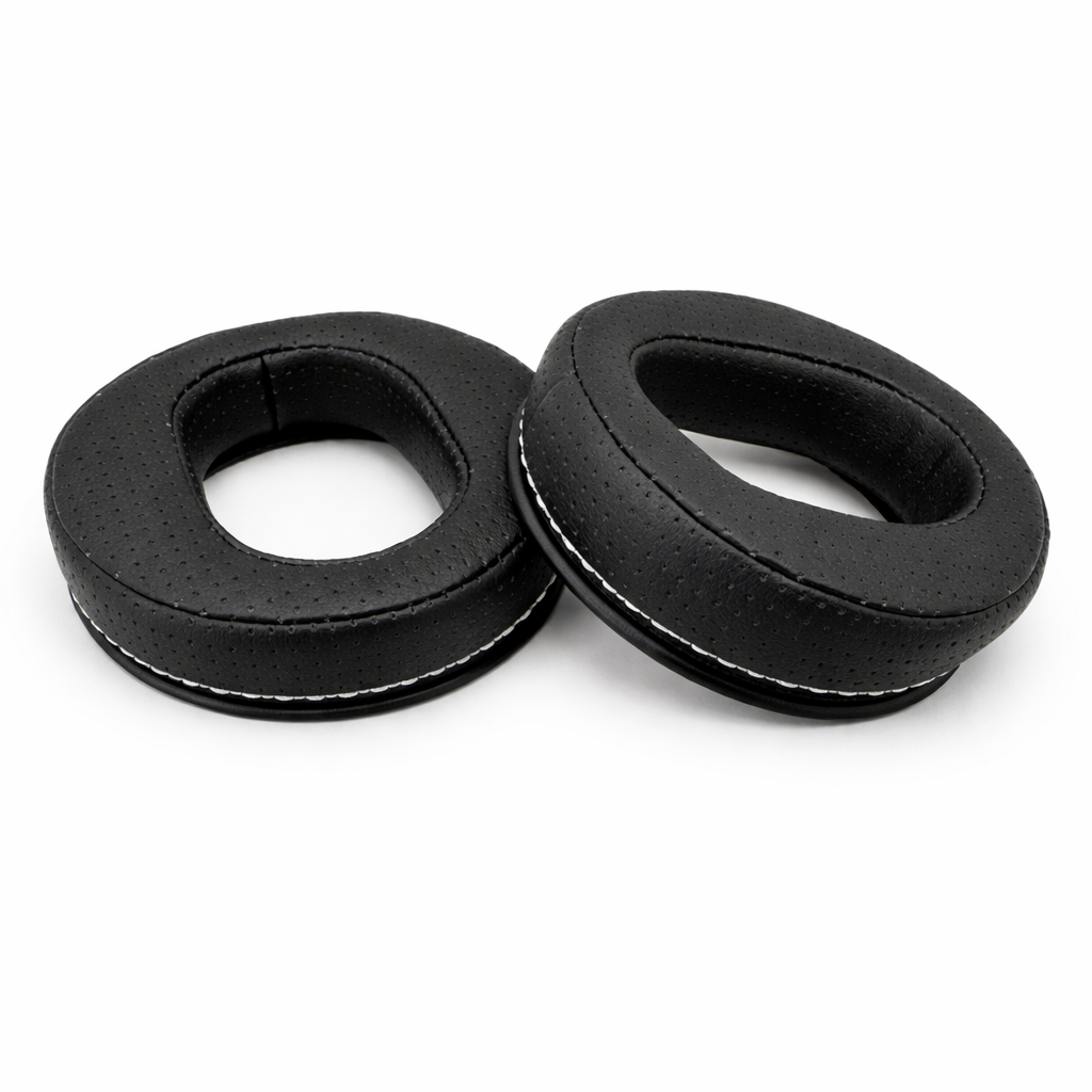 Two black earbud cushions on a white background