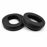Two black earbud cushions on a white background