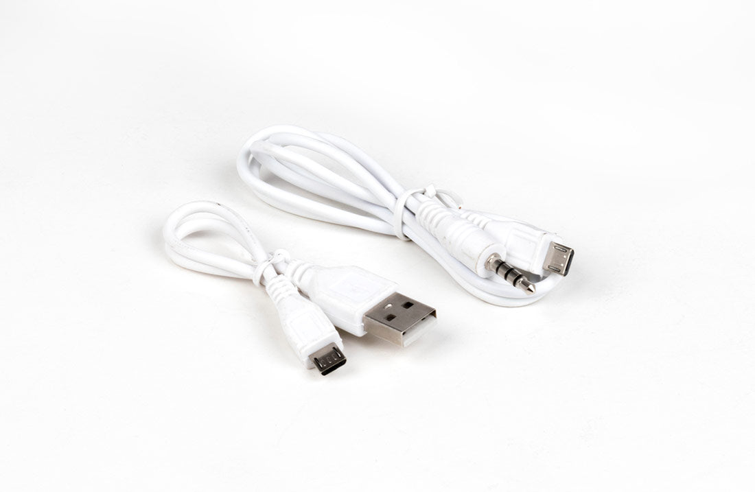 VocoPro Pop-Up Oke karaoke microphone accessory cables including USB charging cable, 3.5mm audio cable, and micro USB cable for power, audio connection, and device compatibility