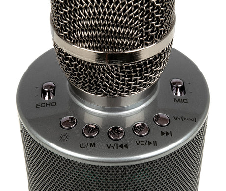 Close-up of the VocoPro Pop-Up-Oke control panel featuring chrome buttons for Echo, Mic volume, Power/Mode, LED light control, and playback navigation sitting atop the integrated mesh speaker