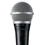 Detailed close-up of the Shure PGA48 dynamic microphone head with silver ball grille and black body, highlighting textured finish and cardioid pickup design